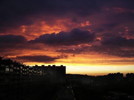 Nightfall in the city - frightening sky above panel houses