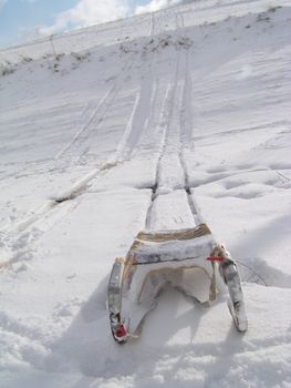 Sledge on the snow under the hill