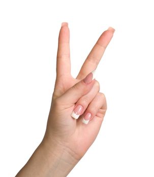 Women's hand shows the gesture of victory is isolated on a white background.