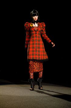 NEW YORK, NY - FEBRUARY 14: A model walks the runway at the Betsey Johnson Fall 2011 fashion show during Mercedes-Benz Fashion Week at The Theatre at Lincoln Center on February 14, 2011 in New York City. (Photo by Diana Beato)