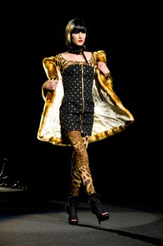 NEW YORK, NY - FEBRUARY 14: A model walks the runway at the Betsey Johnson Fall 2011 fashion show during Mercedes-Benz Fashion Week at The Theatre at Lincoln Center on February 14, 2011 in New York City. (Photo by Diana Beato)