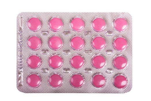 Packing pink pills isolated on a white background