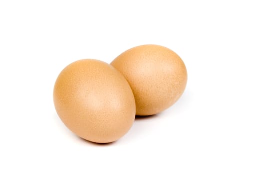 Brown eggs on white background