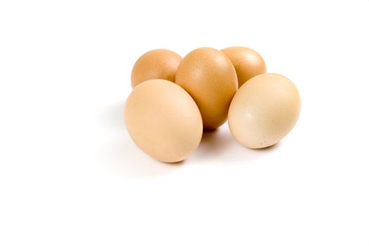 Brown eggs on white background