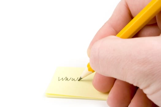 Writing web address on yellow paper