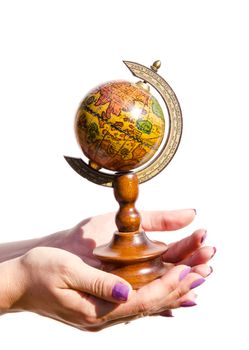 globe in the woman hands on white background