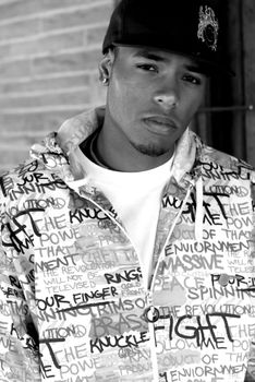 Attractive young man in a jacket and hat.