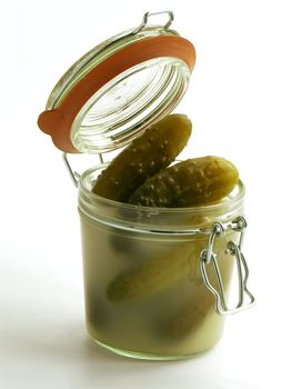 pickled cucumbers in a glass pot