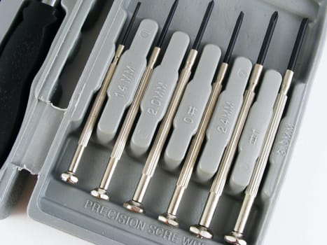 Precision screwdrivers that are part of a small tool kit intended for home use.