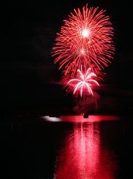 Fireworks by the wharf on Memphremagog lake in Magog, province of Quebec, Canada