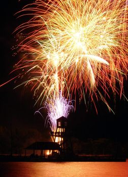 Fireworks by the wharf on Memphremagog lake in Magog, province of Quebec, Canada