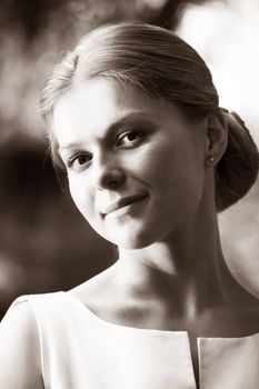 Portrait of the beautiful bride in park