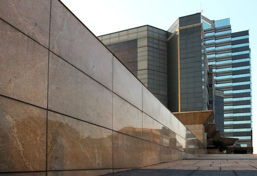 Modern office building with glass and granite tiles