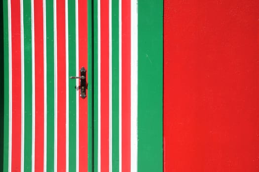 Red door of a typical fisherman house in the Maldives