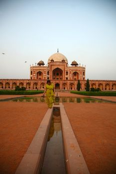 Humayun tomb in New Delhi with a woman walking - not recognizable