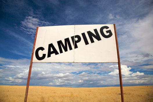 Camping signboard in the de desert of Namibia