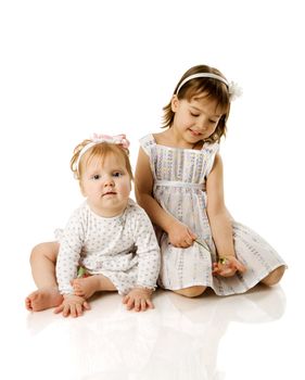 Two little Sisters playing together isolated on white