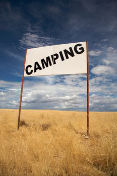 Camping signboard in the de desert of Namibia