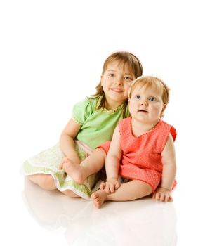 Two little Sisters playing together isolated on white