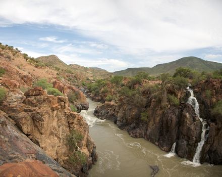 The Epupa Falls lie on the Kunene River, on the border of Angola and Namibia