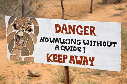 Danger lion signboard on fence in Harnas foundation