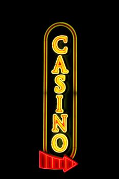 Casino sign with a red arrow in neon lights isolated on black