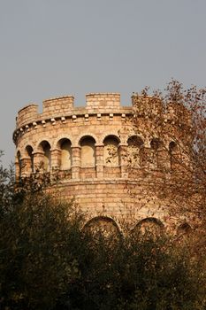 Replica of a castle tower built in stone with arches