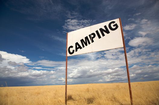 Camping signboard in the de desert of Namibia