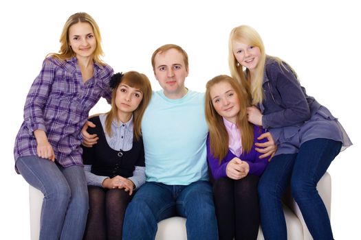 Big family on the couch - four women and one man only isolated on white background