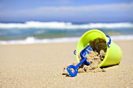 Toy bucket and shovel on the beach