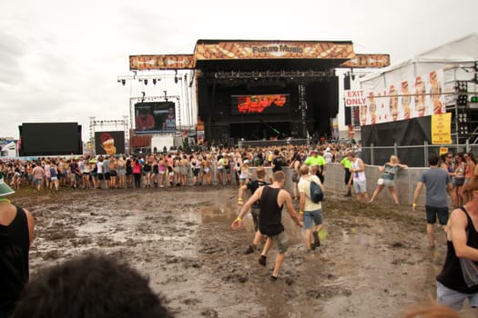 People dancing in the mud at the Future Musical Festival 2011 at Brisbane Australia.