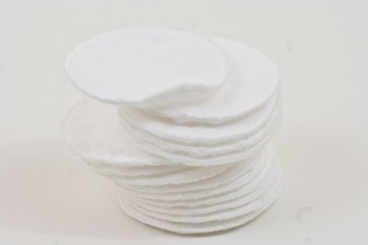 Cotton rounds on a white background.