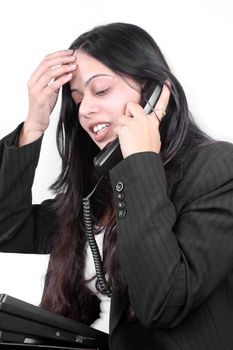 An Indian businesswoman facing problem in communicating with a client over a telephonic conversation.