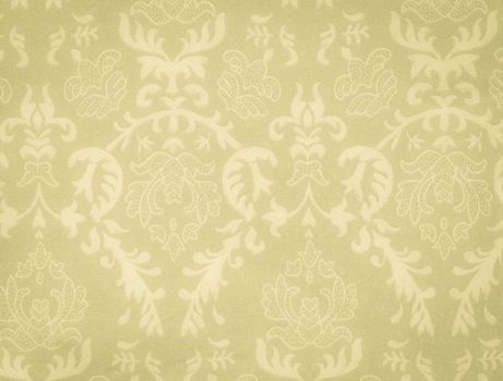 faded low contrast green-yellow vintage background with damask-like ornamental pattern