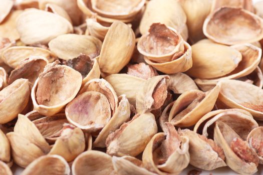 Closeup view of heap of pistachios nutshells.