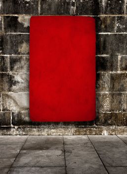 Red grunge background over a old stone wall