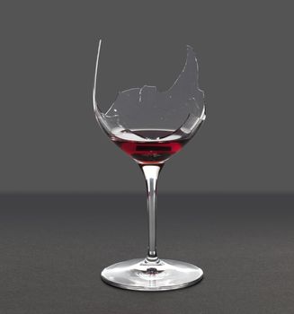 Red wine in a broken wine glass with an extraction path saved in the file