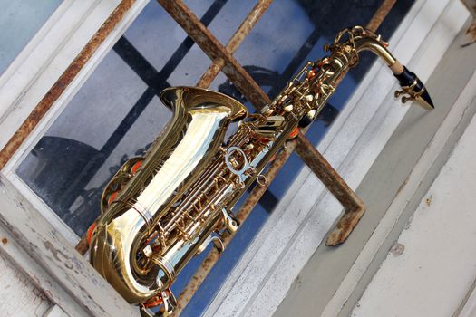old grungy saxophone with old retro background