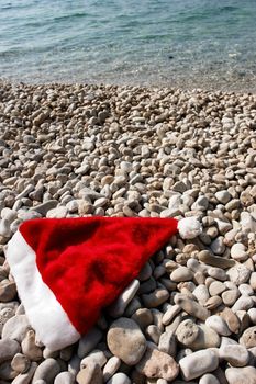 santa cap at the beach at xmas