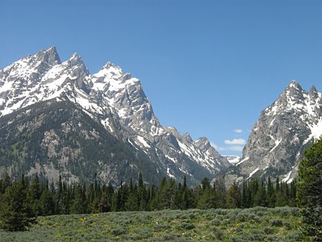 A photograph of a peaceful mountain landscape.