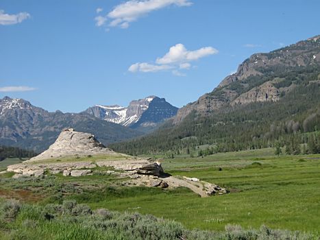 A photograph of a peaceful mountain landscape.