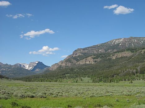 A photograph of a peaceful mountain landscape.