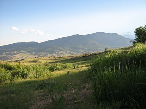 A photograph of a peaceful mountain landscape.