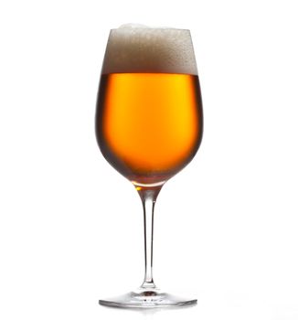 Chilled isolated wine goblet with small droplets of condensation on the outside of the glass and filled with golden colored beer