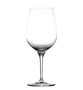 Chilled isolated wine goblet with small droplets of condensation on the outside of the glass