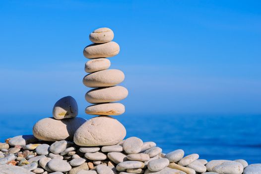 Stack of zen stones on a sky background