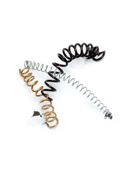 Three metal springs on white disrupt paper background