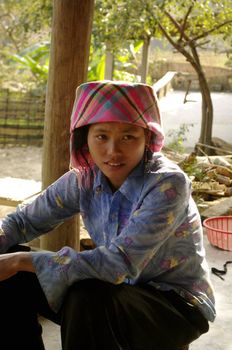 Girl Thai ethnicity, the largest minority in North Vietnam. The Thai merchants are. They live in the valleys in houses on stilts. Their dress is very modern