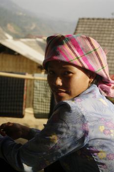 Girl Thai ethnicity, the largest minority in North Vietnam. The Thai merchants are. They live in the valleys in houses on stilts. Their dress is very modern