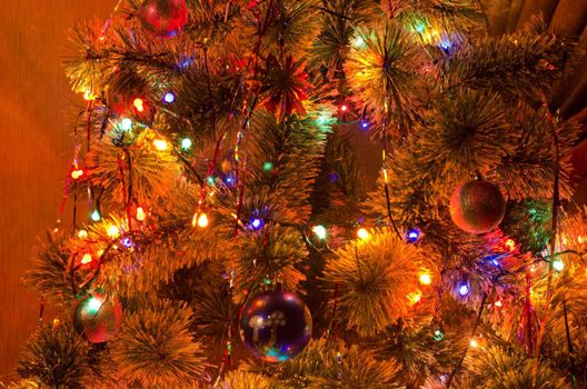 Beautiful Christmas fur-tree decorated with New Year's toys